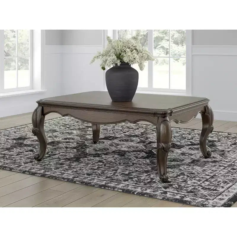 Signature Design by Ashley Maylee Coffee Table with Dark Brown Finish and Cabriole Legs